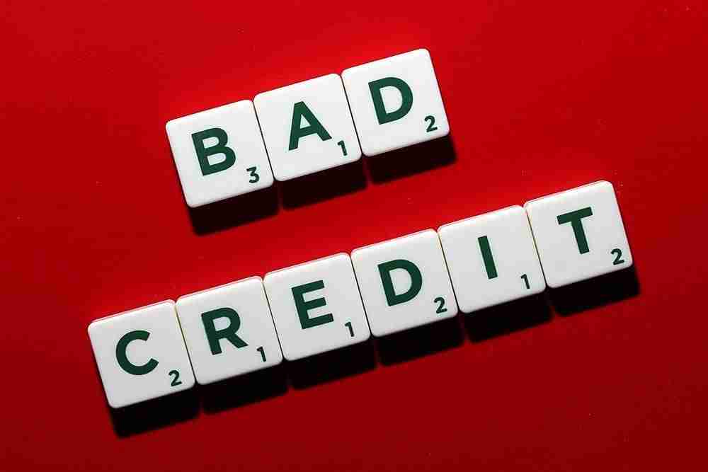 Adverse Credit Loans Get Accepted Online Scrabble tiles spell out "adverse credit" on a red background, highlighting the concept of financial trouble or poor creditworthiness.