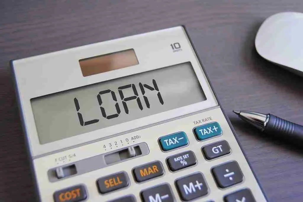 Digital calculator displaying the word "love" spelled with numbers, accompanied by a pen and a computer mouse on a desk, symbolizing the need for a $50 loan.