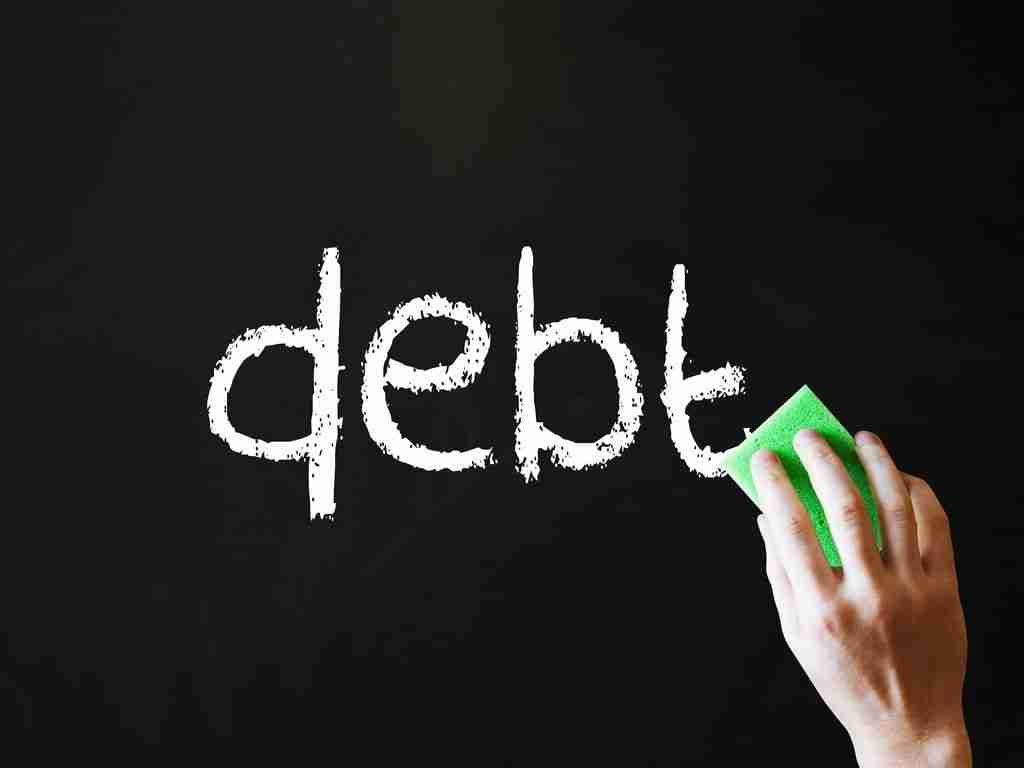 CCC Debt Management debt written with white chalk on blackboard