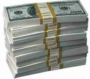 Stacks of unsecured cash dollars bundled and secured with currency straps.