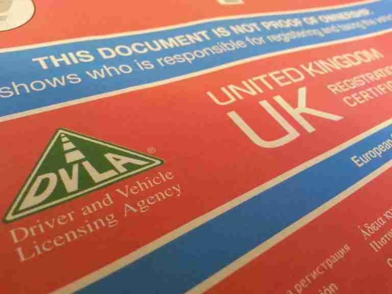 A macro shot of a document from the driver and vehicle licensing agency (dvla) of the united kingdom, with the dvla logo and "united kingdom uk" text visible.