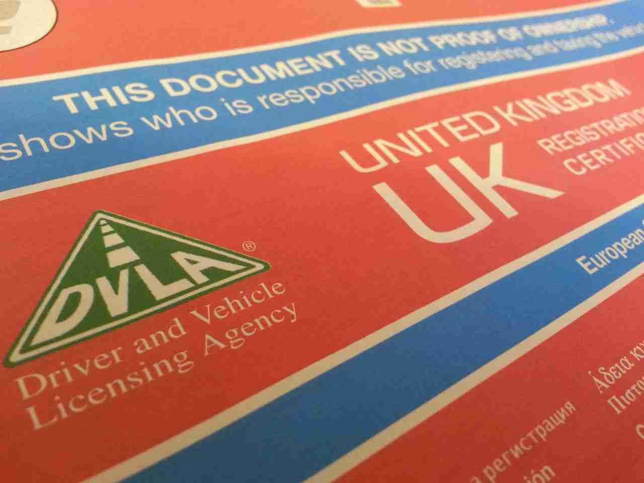 A macro shot of a document from the driver and vehicle licensing agency (dvla) of the united kingdom, with the dvla logo and "united kingdom uk" text visible.
