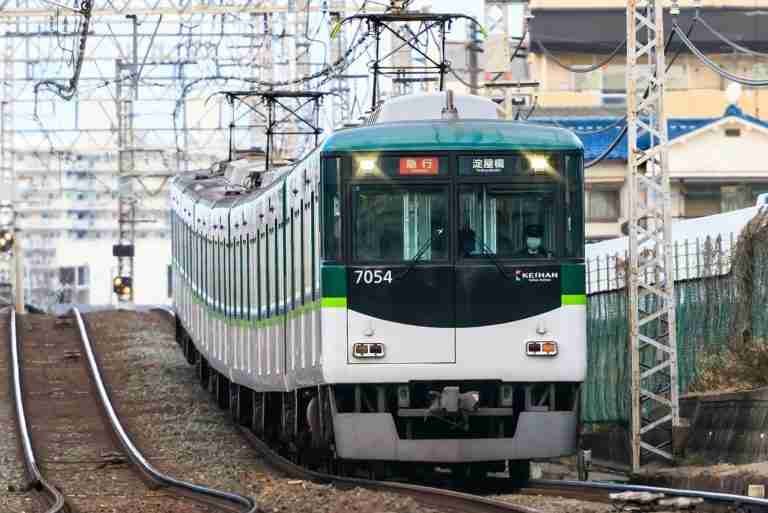 An electric train arriving at a station, modern transit on the rails.