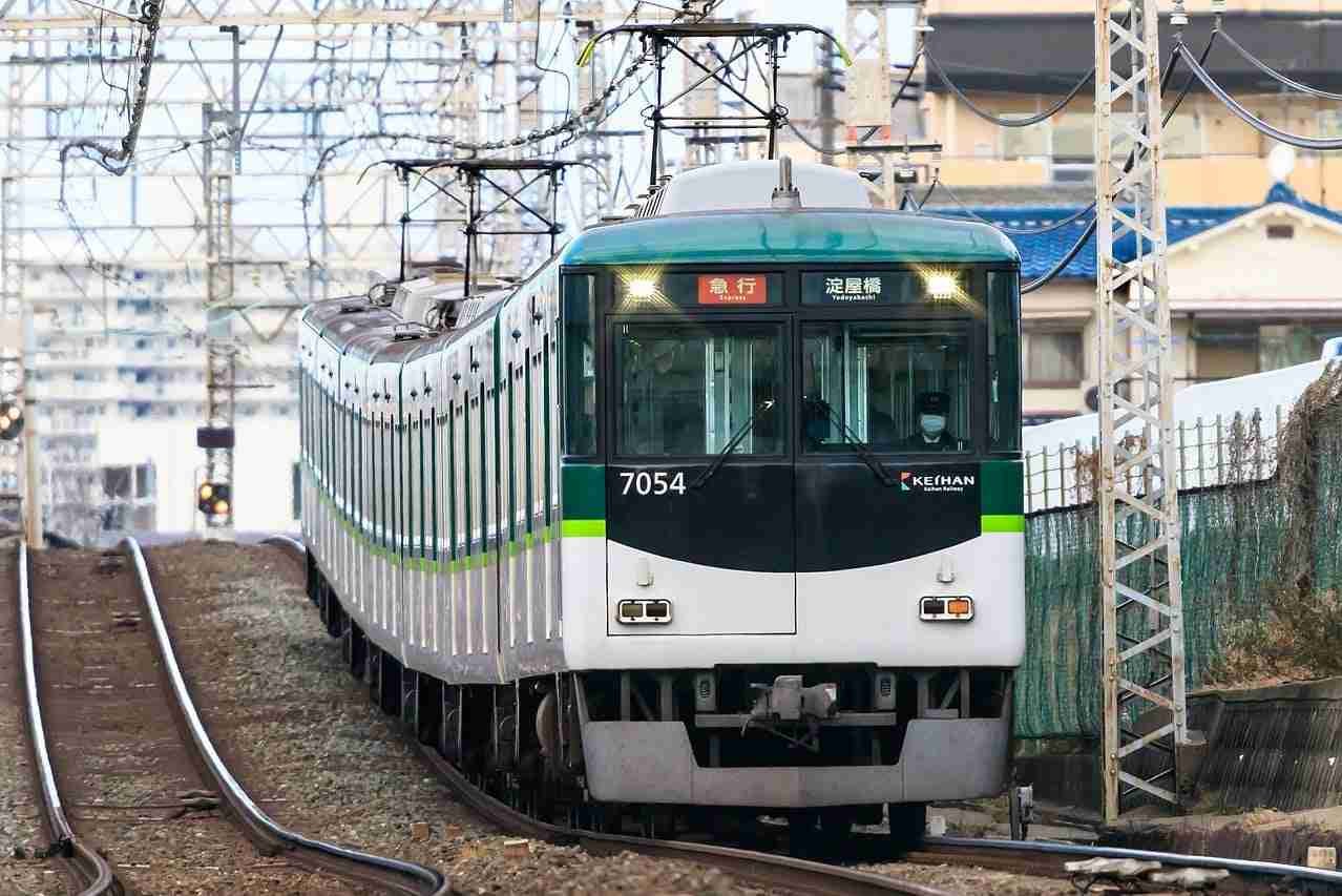 An electric train arriving at a station, modern transit on the rails.